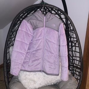 Purple & gray north face jacket, no sizing but it’s about a medium.